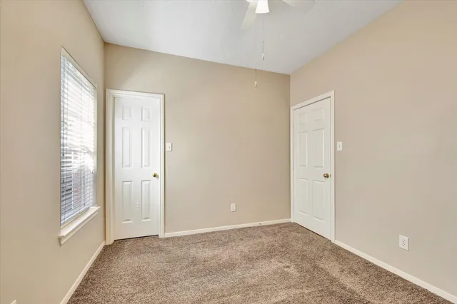 a view of an empty room and window