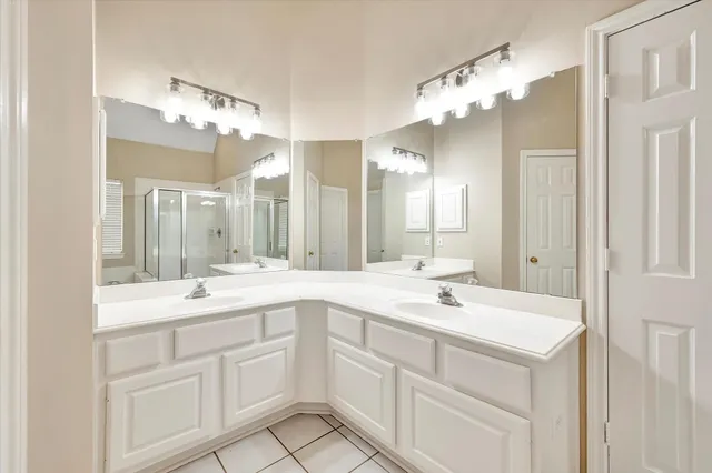 a bathroom with a sink vanity and a mirror