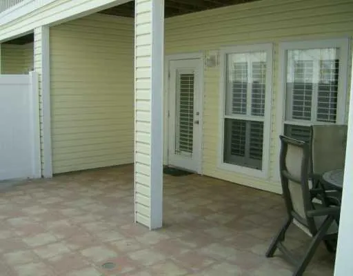 a view of backyard with seating space