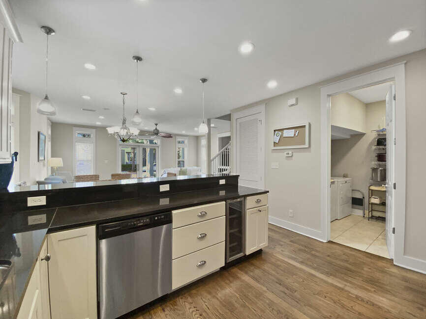 141 Lifeguard Loop East Inlet Beach, FL 32461 - Photo 12 of 40 a kitchen with granite countertop a sink and cabinets