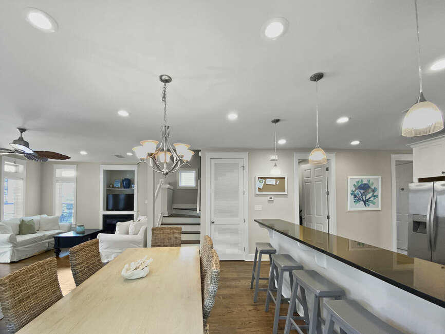141 Lifeguard Loop East Inlet Beach, FL 32461 - Photo 14 of 40 a large living room with kitchen island granite countertop furniture and a chandelier