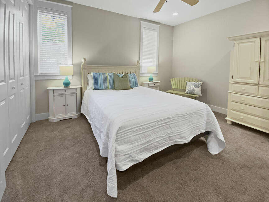 141 Lifeguard Loop East Inlet Beach, FL 32461 - Photo 19 of 40 a bed sitting in a bedroom next to a window