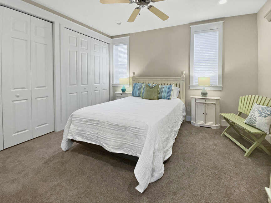 141 Lifeguard Loop East Inlet Beach, FL 32461 - Photo 20 of 40 a spacious bedroom with a bed and a chandelier