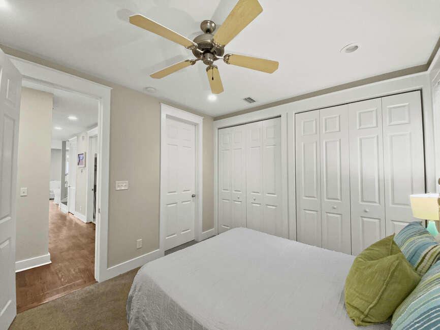141 Lifeguard Loop East Inlet Beach, FL 32461 - Photo 21 of 40 a bedroom with a bed and a chandelier