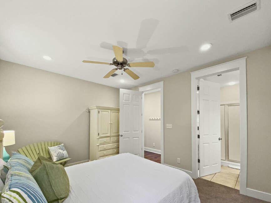 141 Lifeguard Loop East Inlet Beach, FL 32461 - Photo 22 of 40 a bedroom with a bed and a chandelier