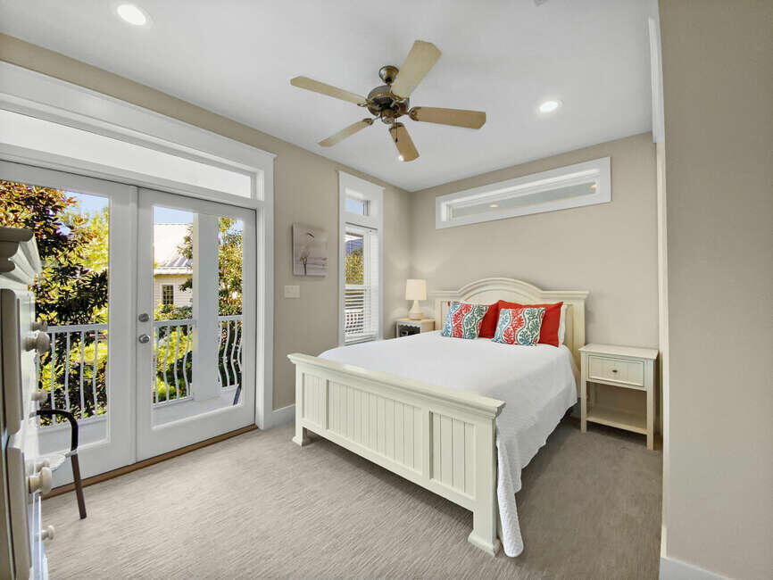141 Lifeguard Loop East Inlet Beach, FL 32461 - Photo 23 of 40 a bedroom with a large bed and a chandelier