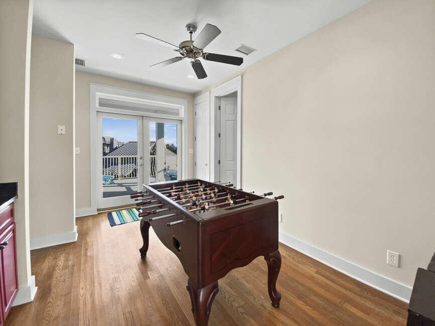 141 Lifeguard Loop East Inlet Beach, FL 32461 - Photo 34 of 40 a kitchen with stainless steel appliances granite countertop a stove and a wooden floors