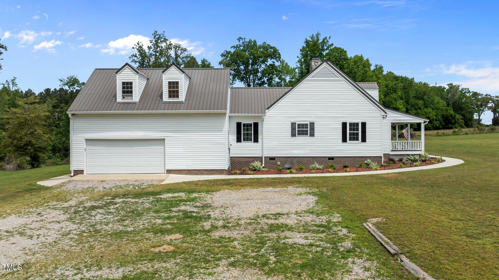 675 Anderson Creek Road Henderson, NC 27537 - Photo 15 of 62 a front view of a house with a yard
