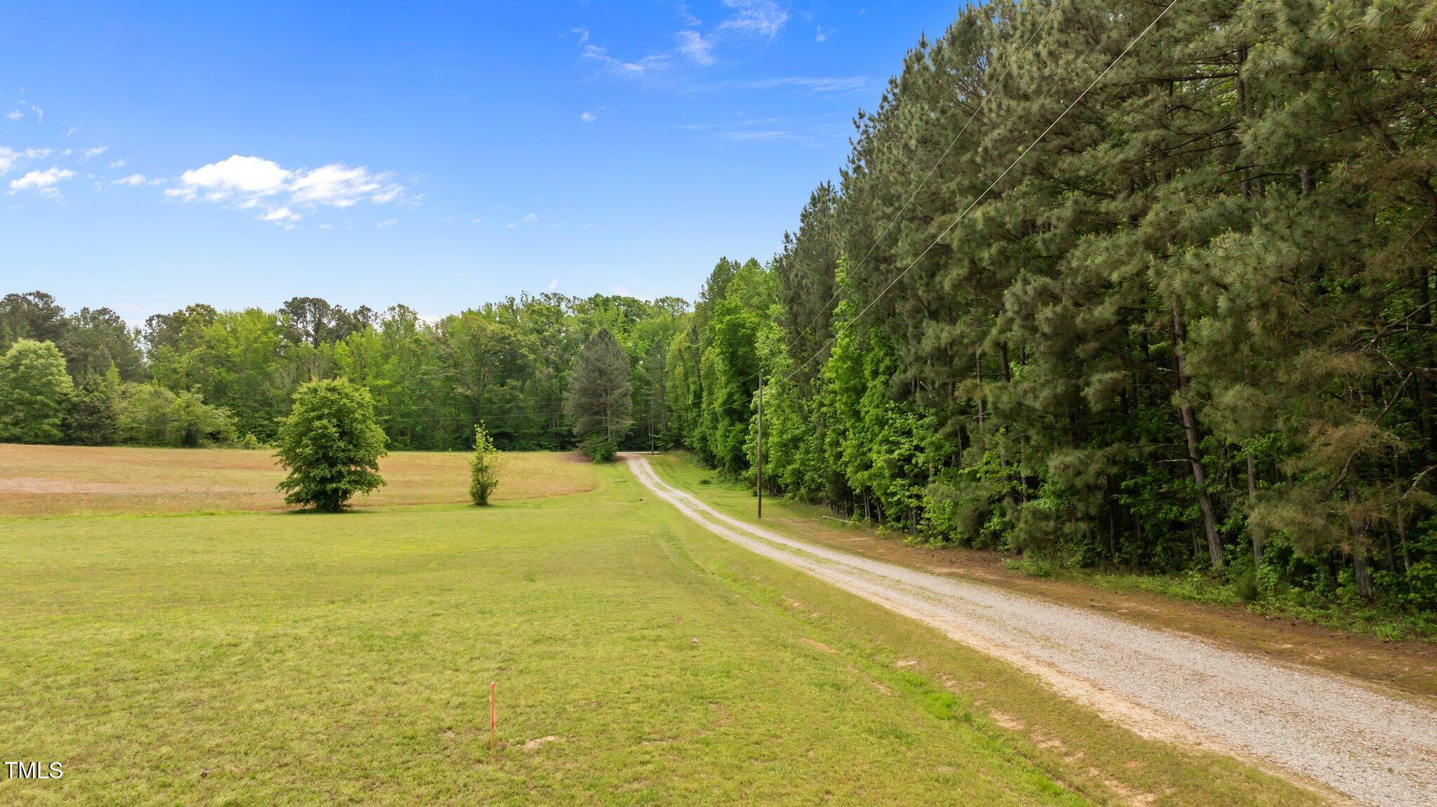 675 Anderson Creek Road Henderson, NC 27537 - Photo 25 of 62 a view of a lake with a yard
