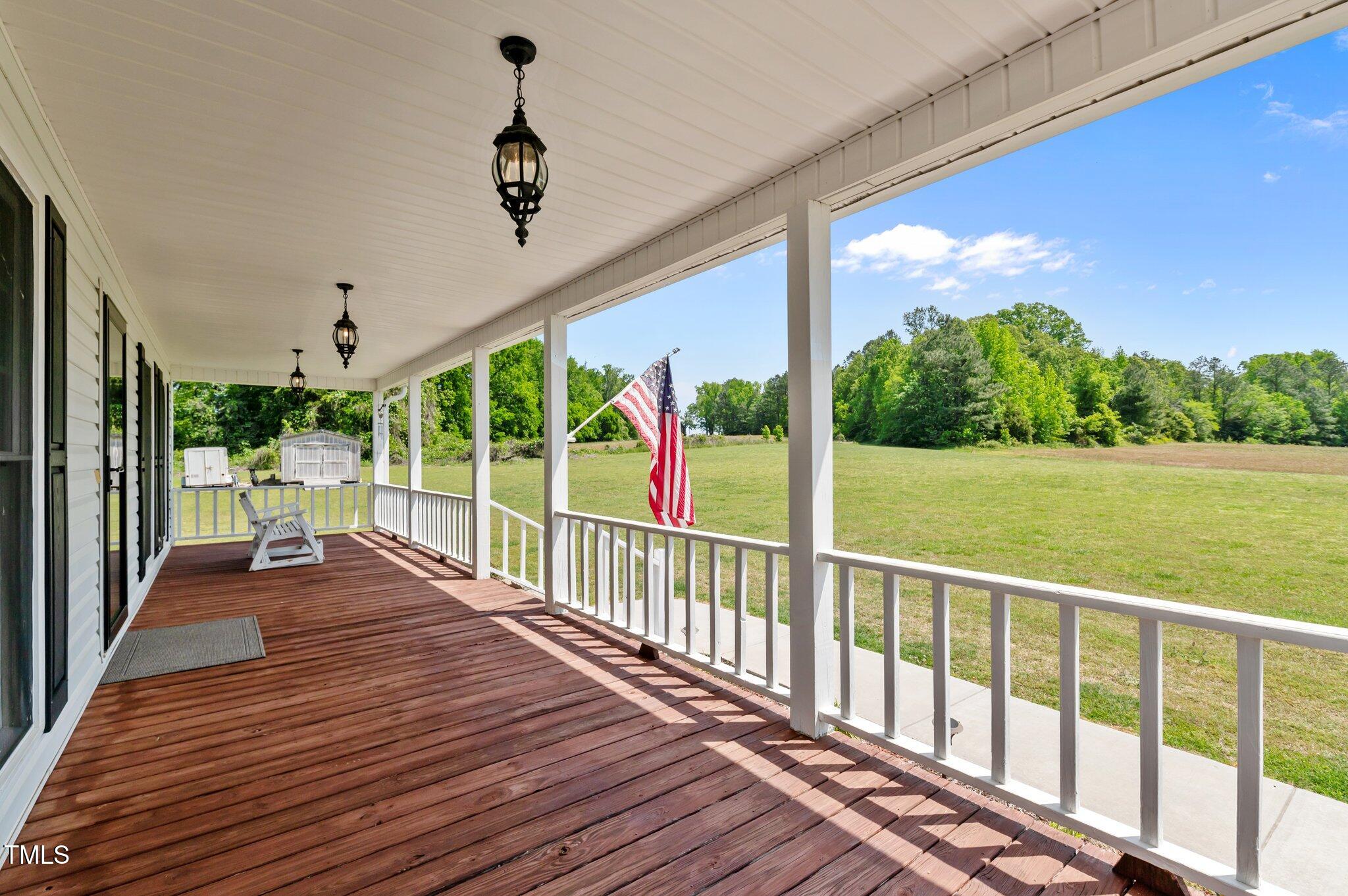 675 Anderson Creek Road Henderson, NC 27537 - Photo 26 of 62 a view of a porch with wooden floor and outdoor space