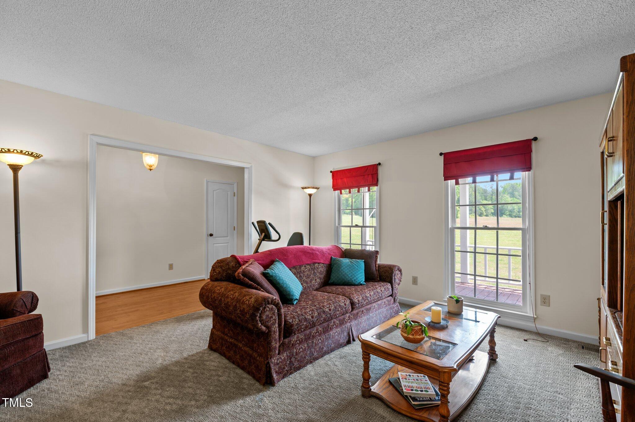 675 Anderson Creek Road Henderson, NC 27537 - Photo 37 of 62 a living room with furniture and a window