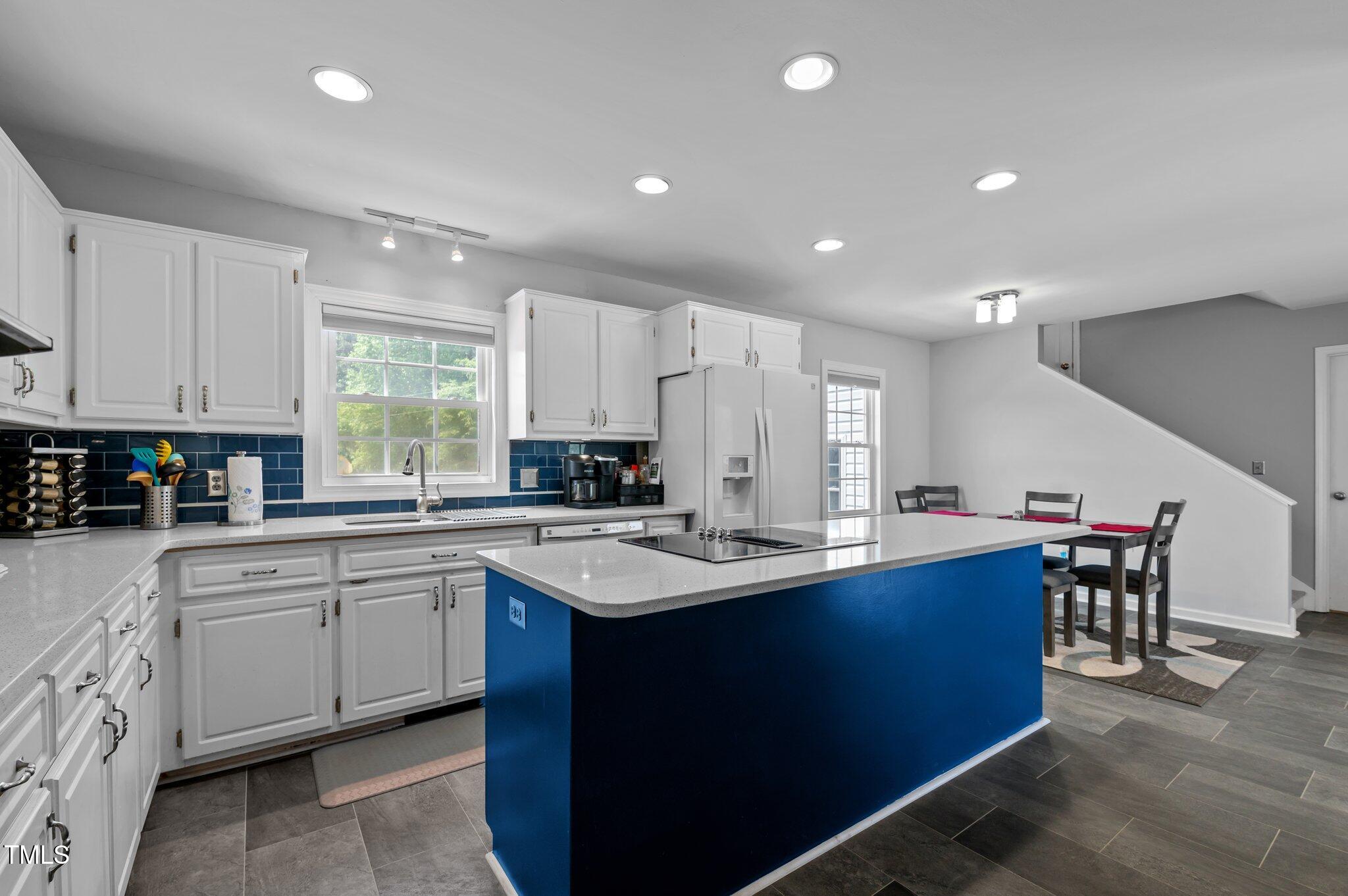 675 Anderson Creek Road Henderson, NC 27537 - Photo 39 of 62 a kitchen with sink cabinets and window