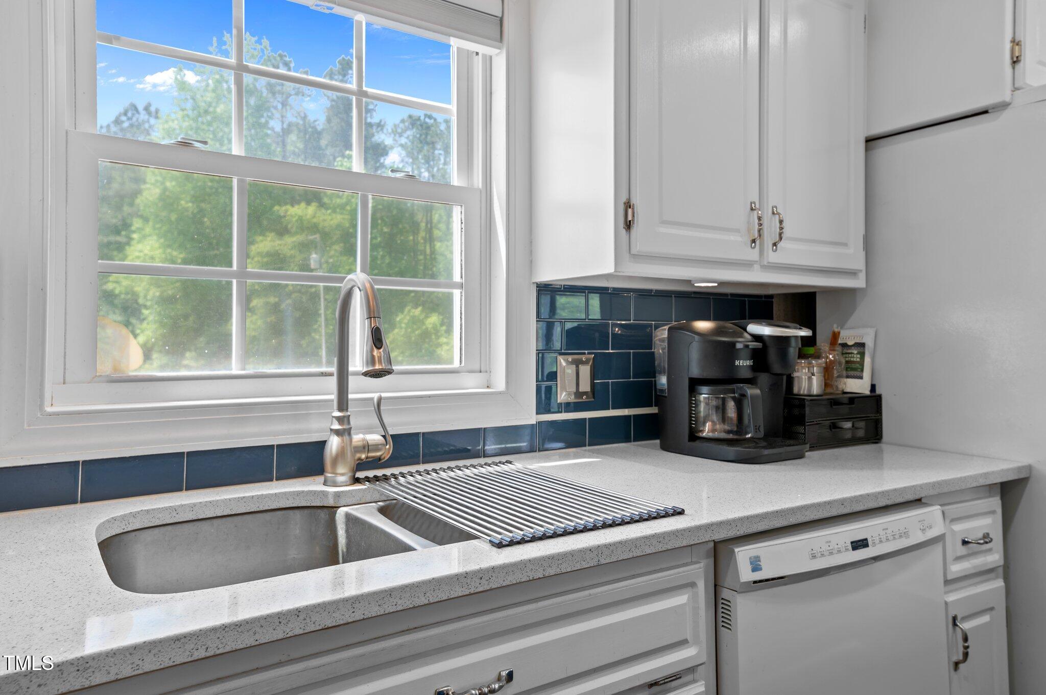 675 Anderson Creek Road Henderson, NC 27537 - Photo 42 of 62 a kitchen sink with granite countertop a sink and cabinets