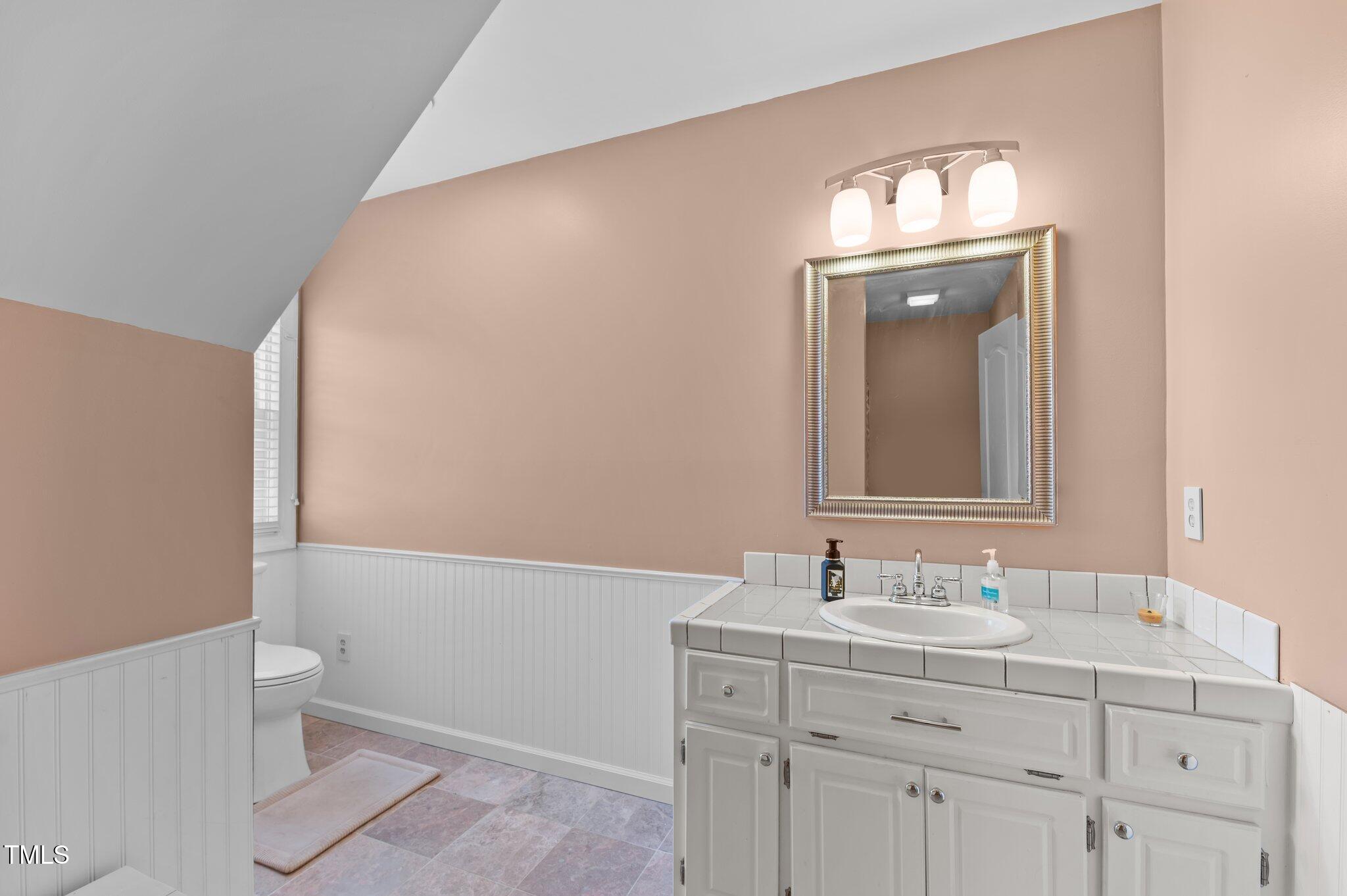 675 Anderson Creek Road Henderson, NC 27537 - Photo 53 of 62 a bathroom with a sink and a mirror