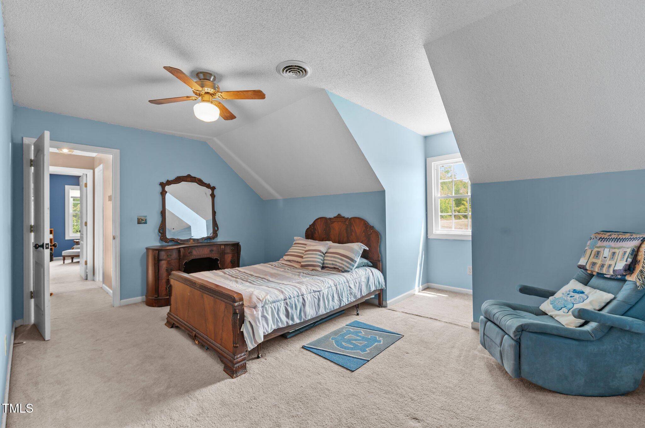 675 Anderson Creek Road Henderson, NC 27537 - Photo 56 of 62 a bedroom with a bed and window