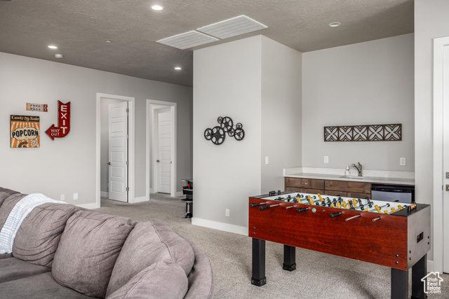 2600 Ocotillo Way, Unit 34 Santa Clara, UT 84765 - Photo 32 of 43 Rec room with carpet floors, a textured ceiling, and recessed lighting