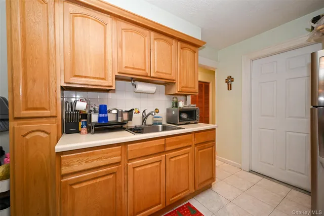 a kitchen with stainless steel appliances granite countertop a refrigerator and cabinets