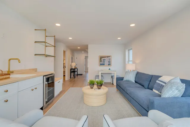 a living room with furniture and a table