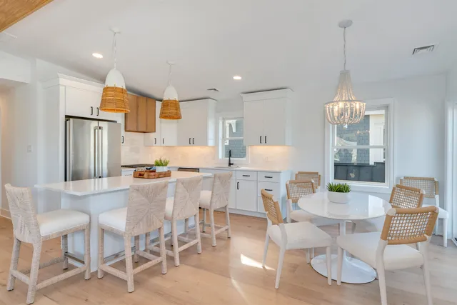 a kitchen with stainless steel appliances granite countertop a sink and a stove