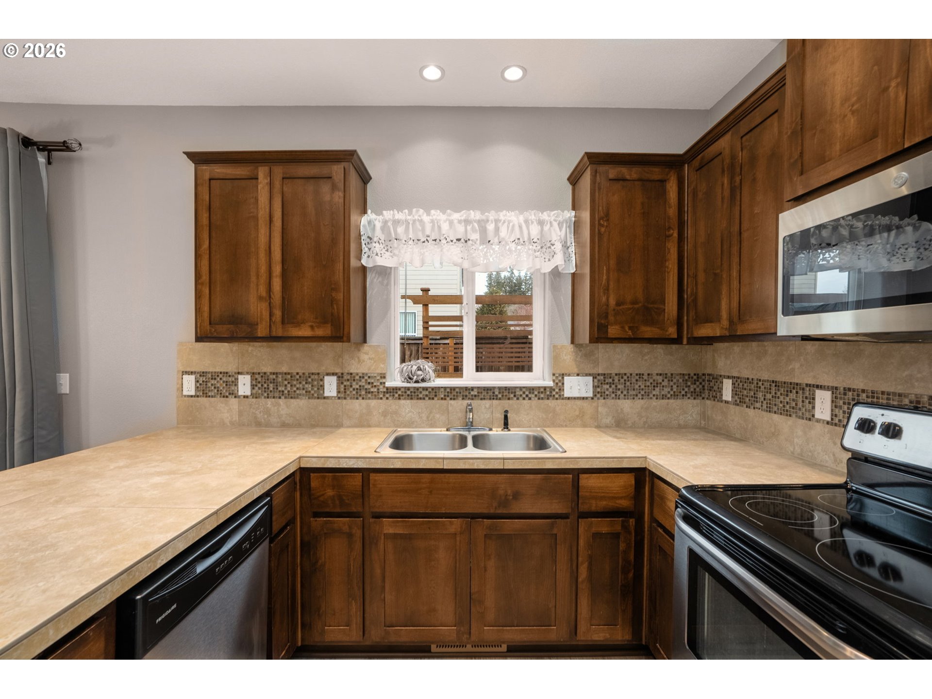52183 Southeast Tussing Way Scappoose, OR 97056 - Photo 13 of 32 a kitchen with a sink and cabinets