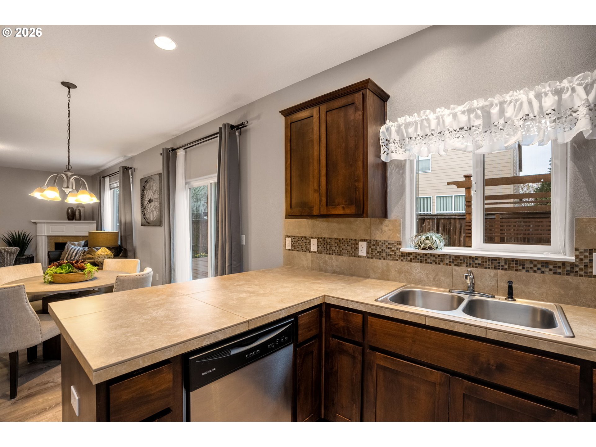 52183 Southeast Tussing Way Scappoose, OR 97056 - Photo 14 of 32 a kitchen with a sink cabinets and window