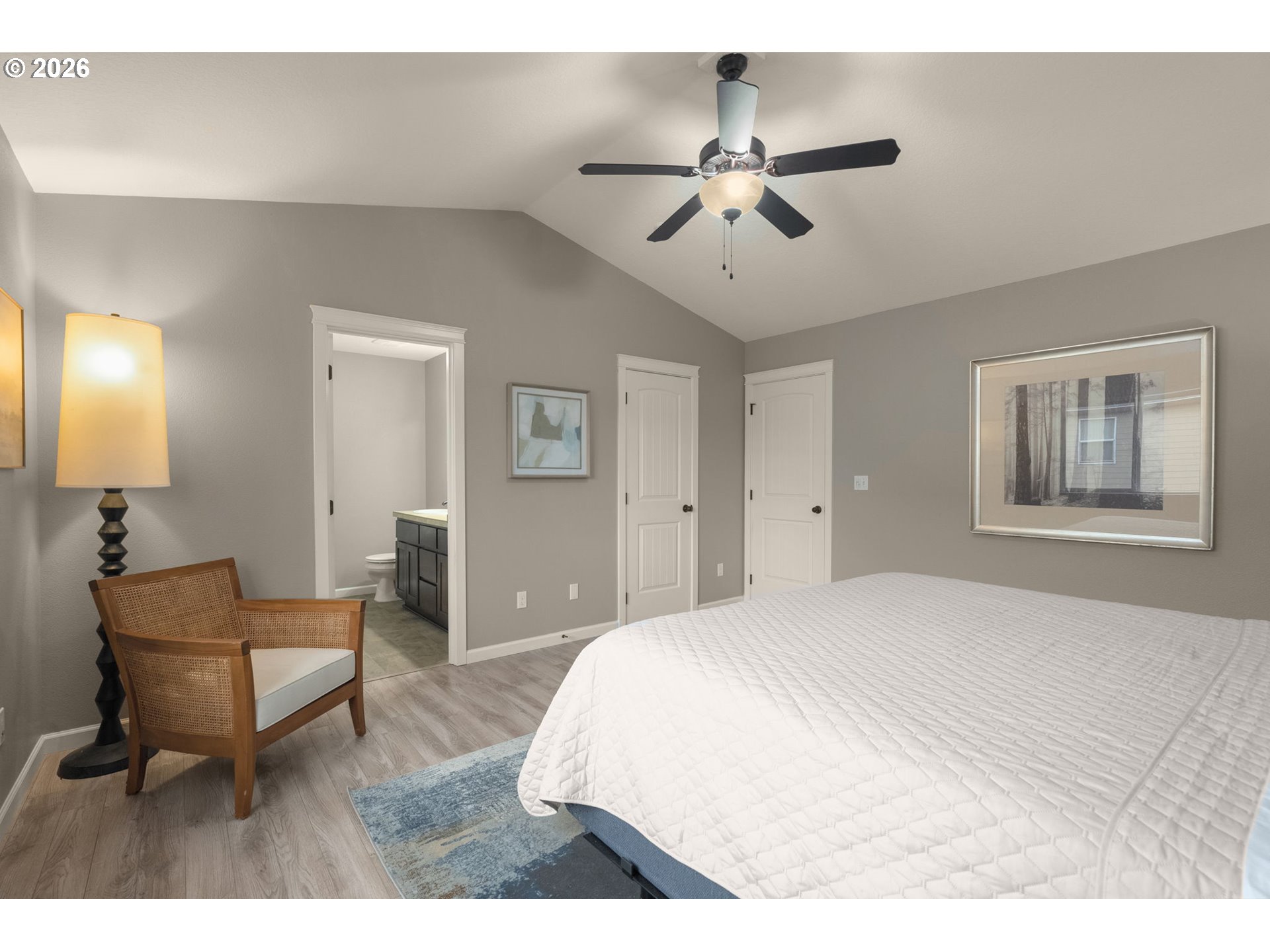 52183 Southeast Tussing Way Scappoose, OR 97056 - Photo 16 of 32 a bedroom with a bed and a chandelier