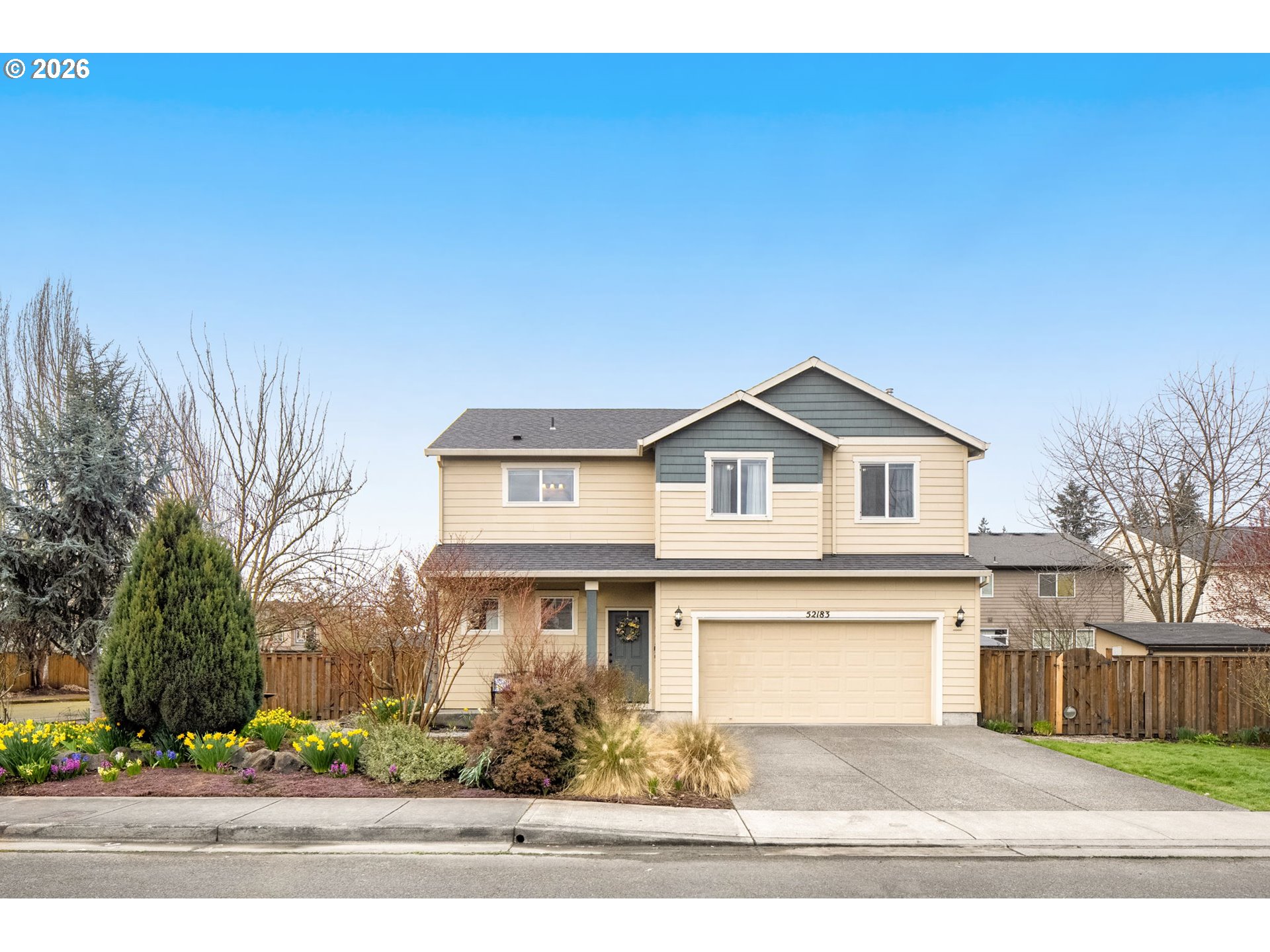 52183 Southeast Tussing Way Scappoose, OR 97056 - Photo 2 of 32 a front view of a house with a yard and garage