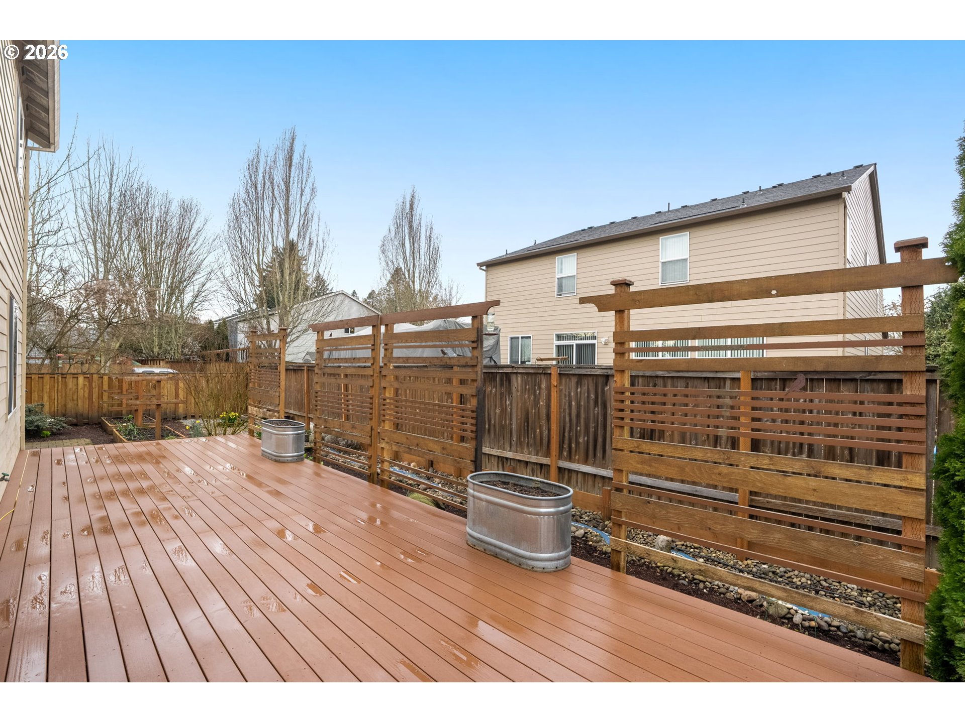 52183 Southeast Tussing Way Scappoose, OR 97056 - Photo 24 of 32 a view of a terrace with wooden floor and fence