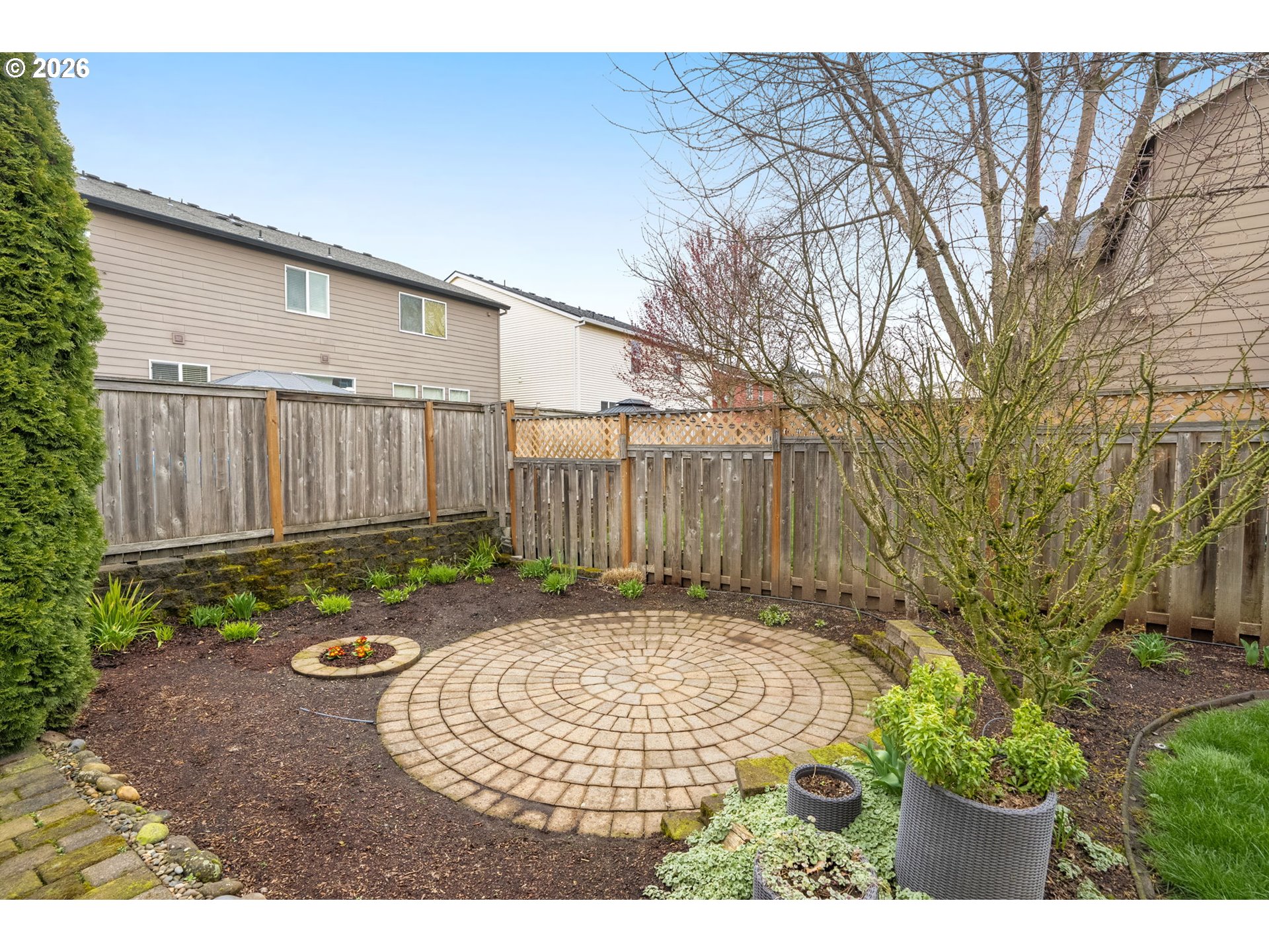 52183 Southeast Tussing Way Scappoose, OR 97056 - Photo 29 of 32 a view of a backyard with wooden fence