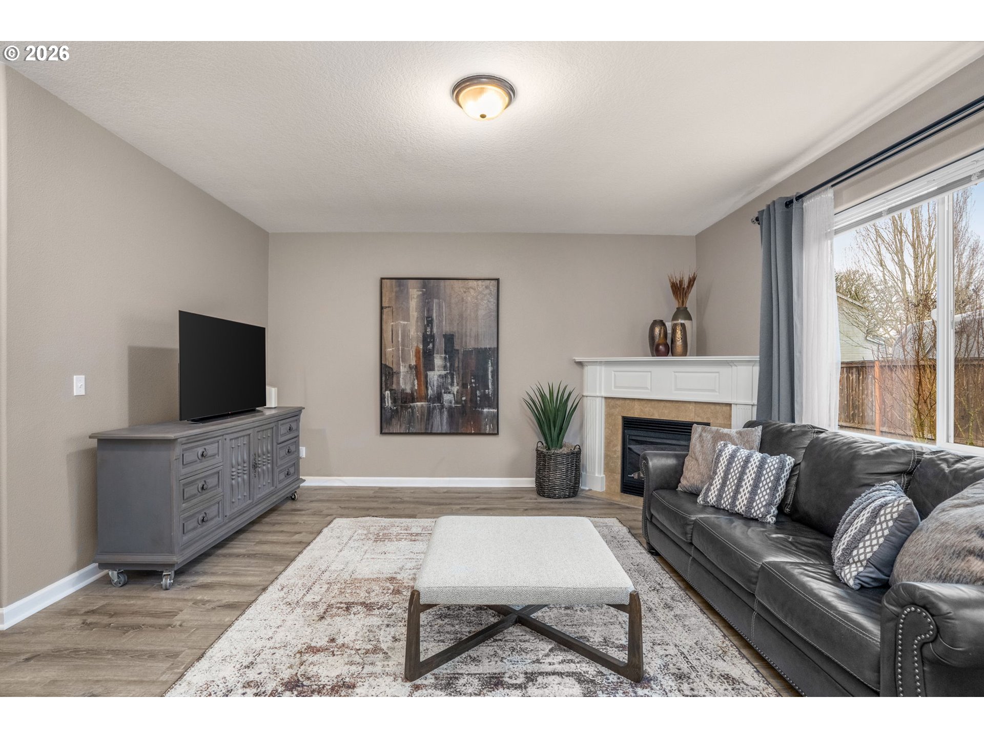 52183 Southeast Tussing Way Scappoose, OR 97056 - Photo 6 of 32 a living room with furniture fireplace and window