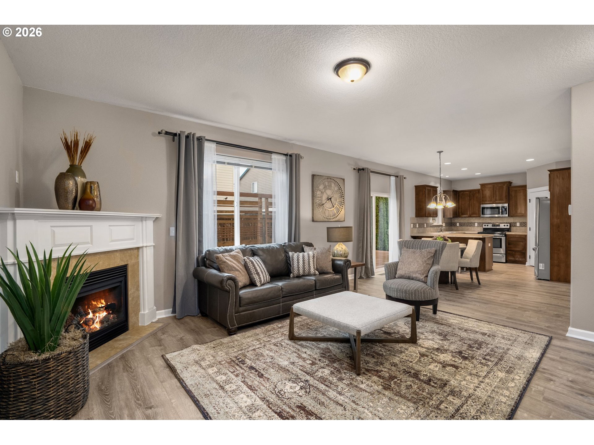 52183 Southeast Tussing Way Scappoose, OR 97056 - Photo 7 of 32 a living room with furniture and a fireplace