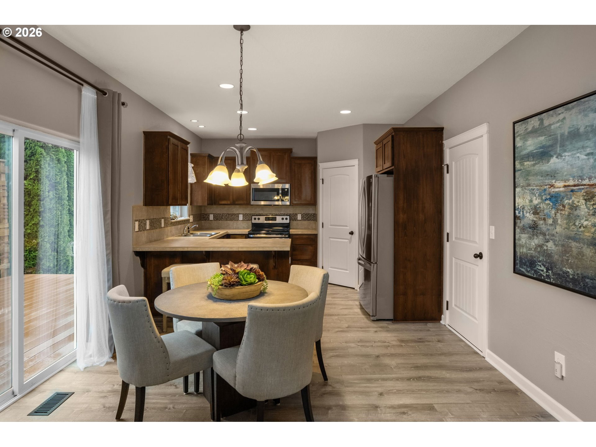 52183 Southeast Tussing Way Scappoose, OR 97056 - Photo 9 of 32 a dining room with furniture and window