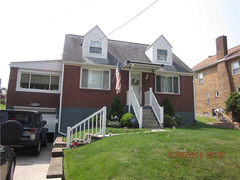 Exterior Front. Newer roof, windows, railings, concrete sidewalk