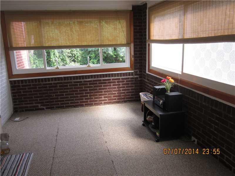 3445 West Run Road Munhall, PA 15120 - Photo 8 of 17 Family Room. 1st floor family room with plenty of windows, exposed brick walls and access to back