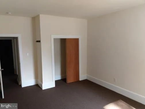 an empty room with closet
