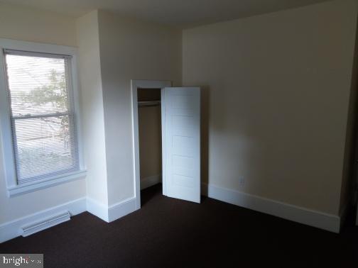 128 South Main Street Glassboro, NJ 08028 - Photo 14 of 21 a view of an empty room with wooden floor and a window