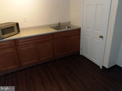a bathroom with a sink and mirror