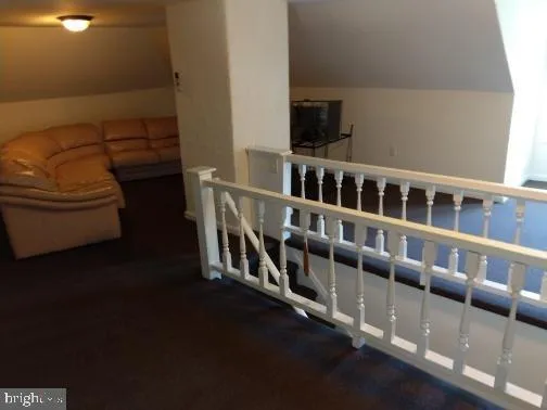 a view of a hallway with seating space