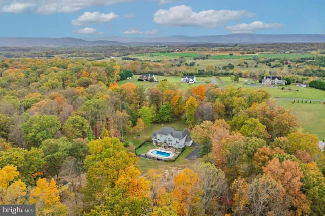 an aerial view of residential house with outdoor space