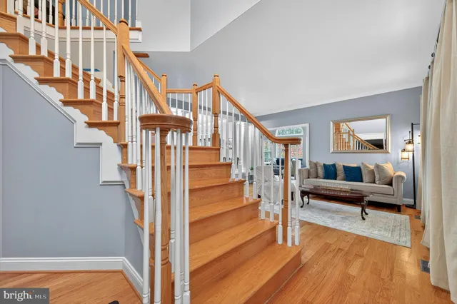 a view of a livingroom with furniture and staircase