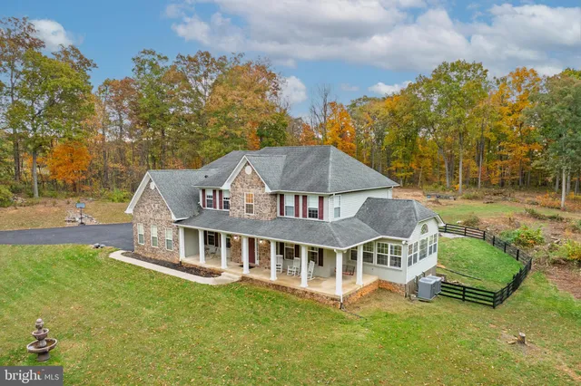 a table and chairs in a room with a window