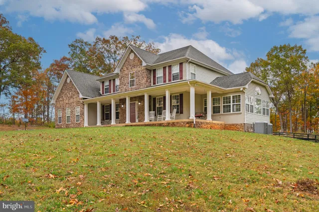 a bedroom with furniture and wooden floor