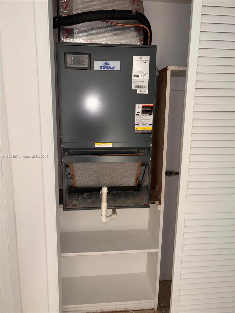 1175 Normandy Drive, Unit 2D Miami Beach, FL 33141 - Photo 8 of 13 a close view of water heater