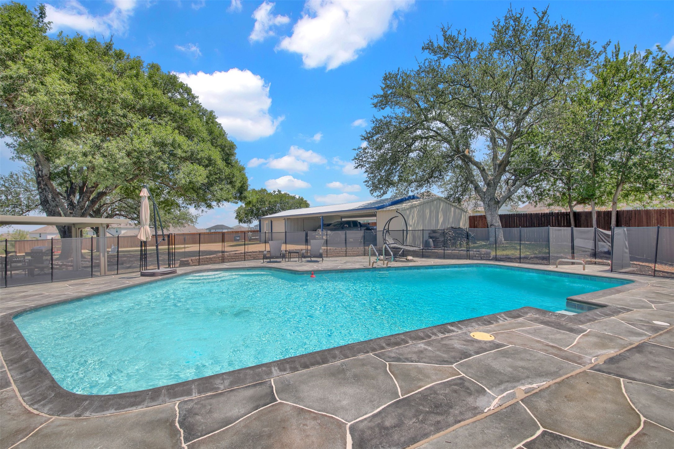 a view of a house with backyard and a slide