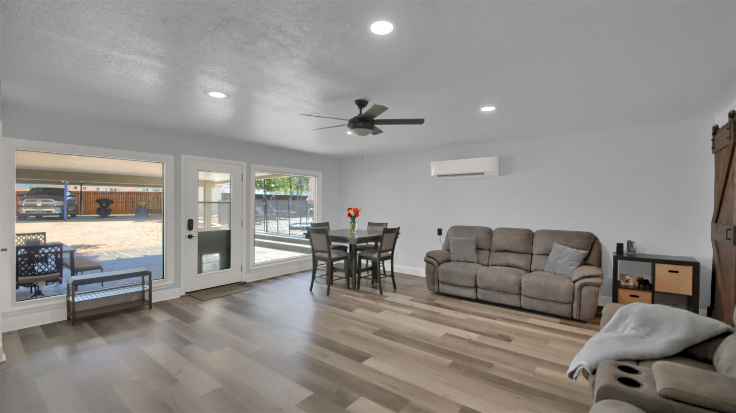 550 C.Bud Stockton Loop Jarrell, TX 76537 - Photo 18 of 37 Second living room featuring recessed lighting, wood finished floors, a ceiling fan, and a wall mounted AC
