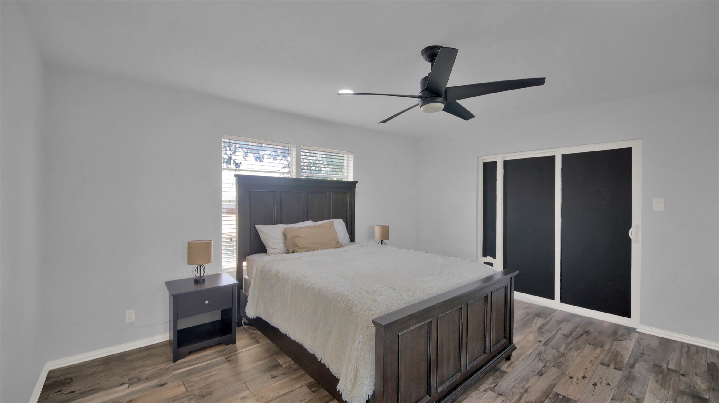 550 C.Bud Stockton Loop Jarrell, TX 76537 - Photo 21 of 37 Primary bedroom with ceiling fan, light wood-style flooring, and a closet
