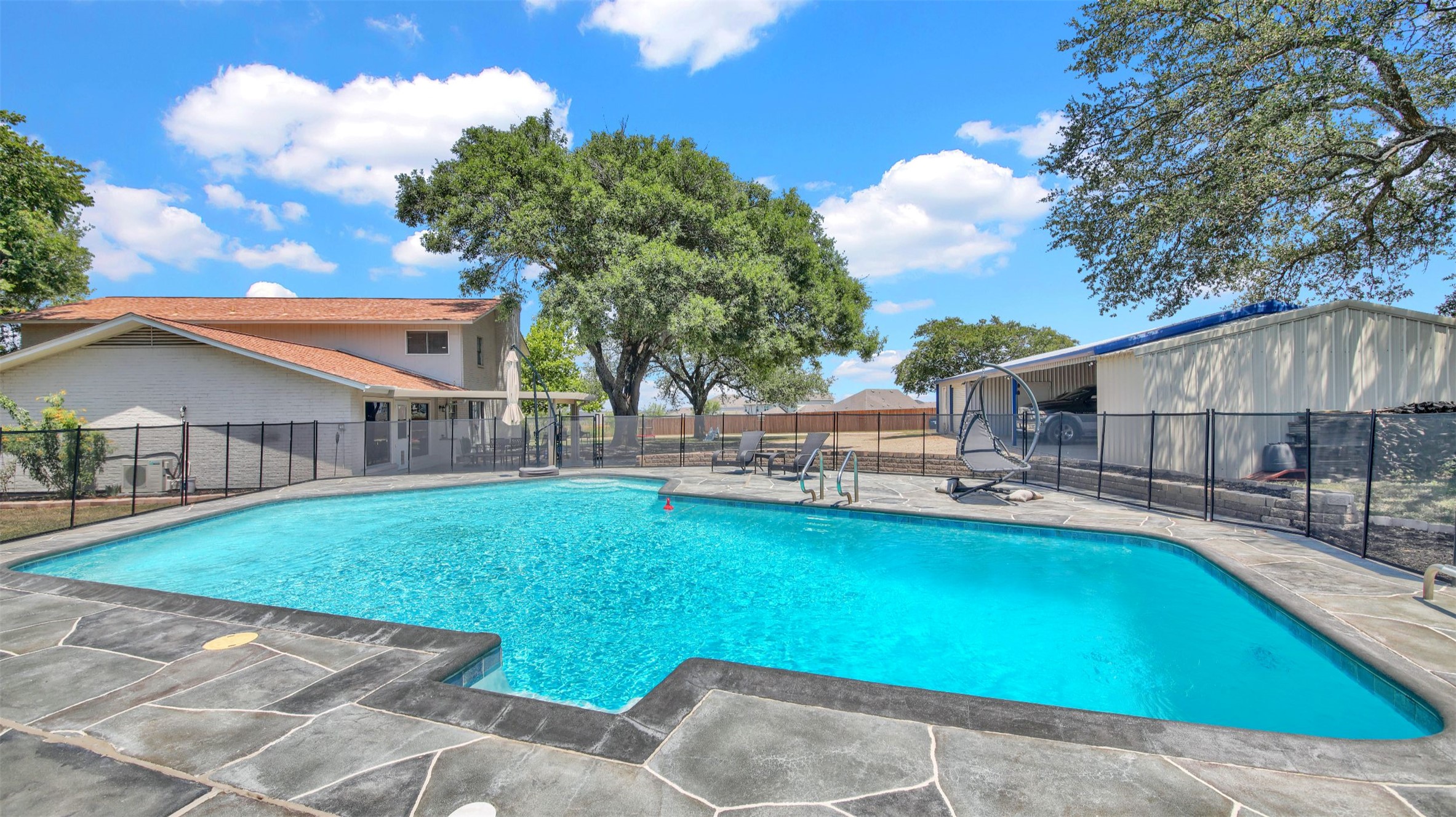 550 C.Bud Stockton Loop Jarrell, TX 76537 - Photo 29 of 37 View of pool with a patio area