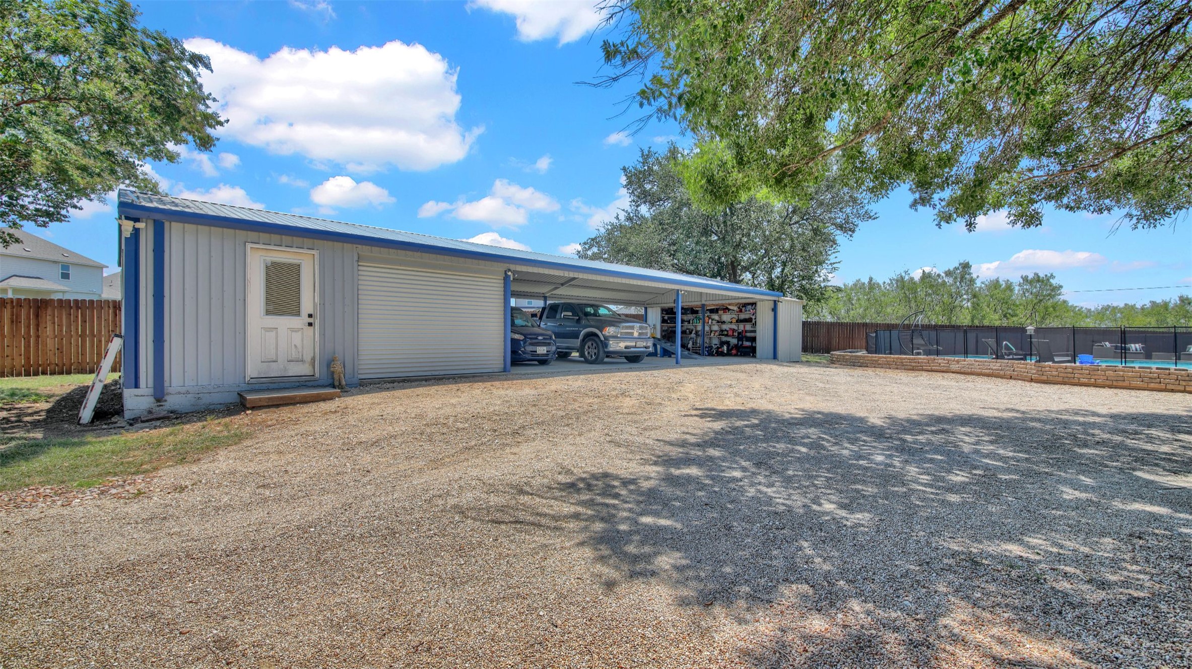 550 C.Bud Stockton Loop Jarrell, TX 76537 - Photo 30 of 37 Carport with attached workshop (with electricity!)