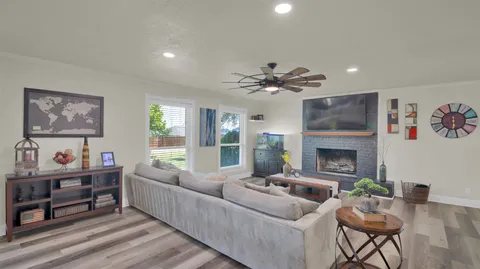 a living room with furniture and a fireplace