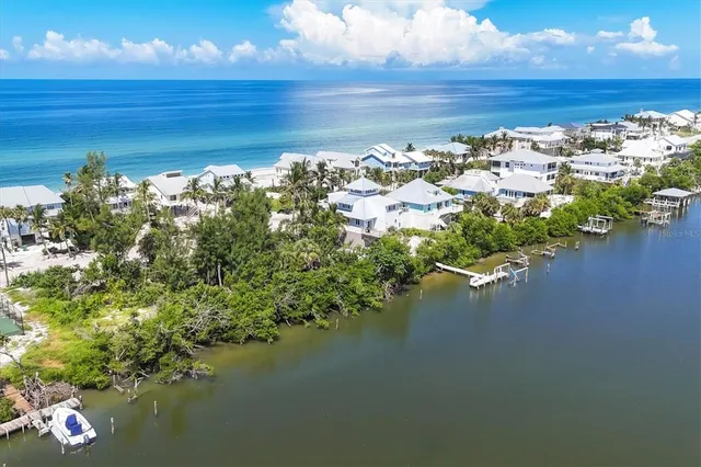 a view of ocean with green space